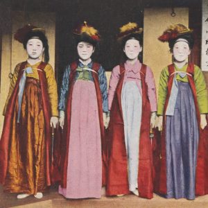 Postcard of four young women in long colorful dresses
