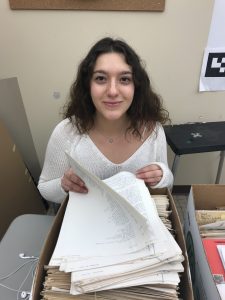 Lafayette student flipping through pages of poetry
